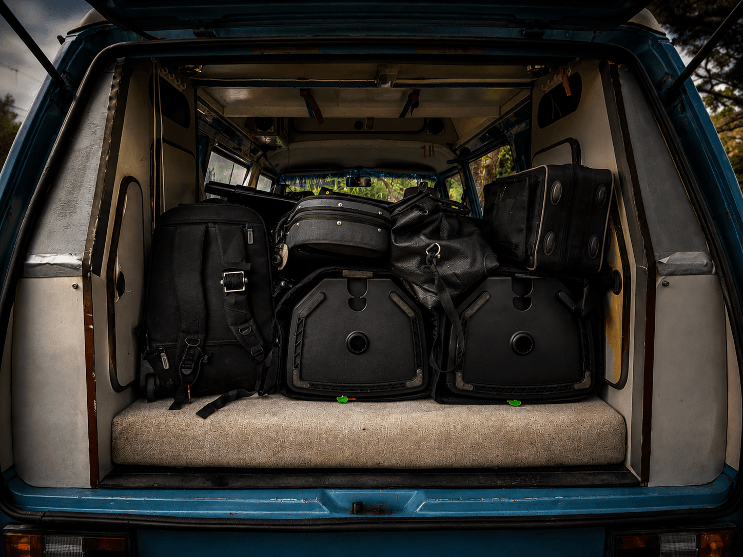 Working musicians loading gear for the road between shows.